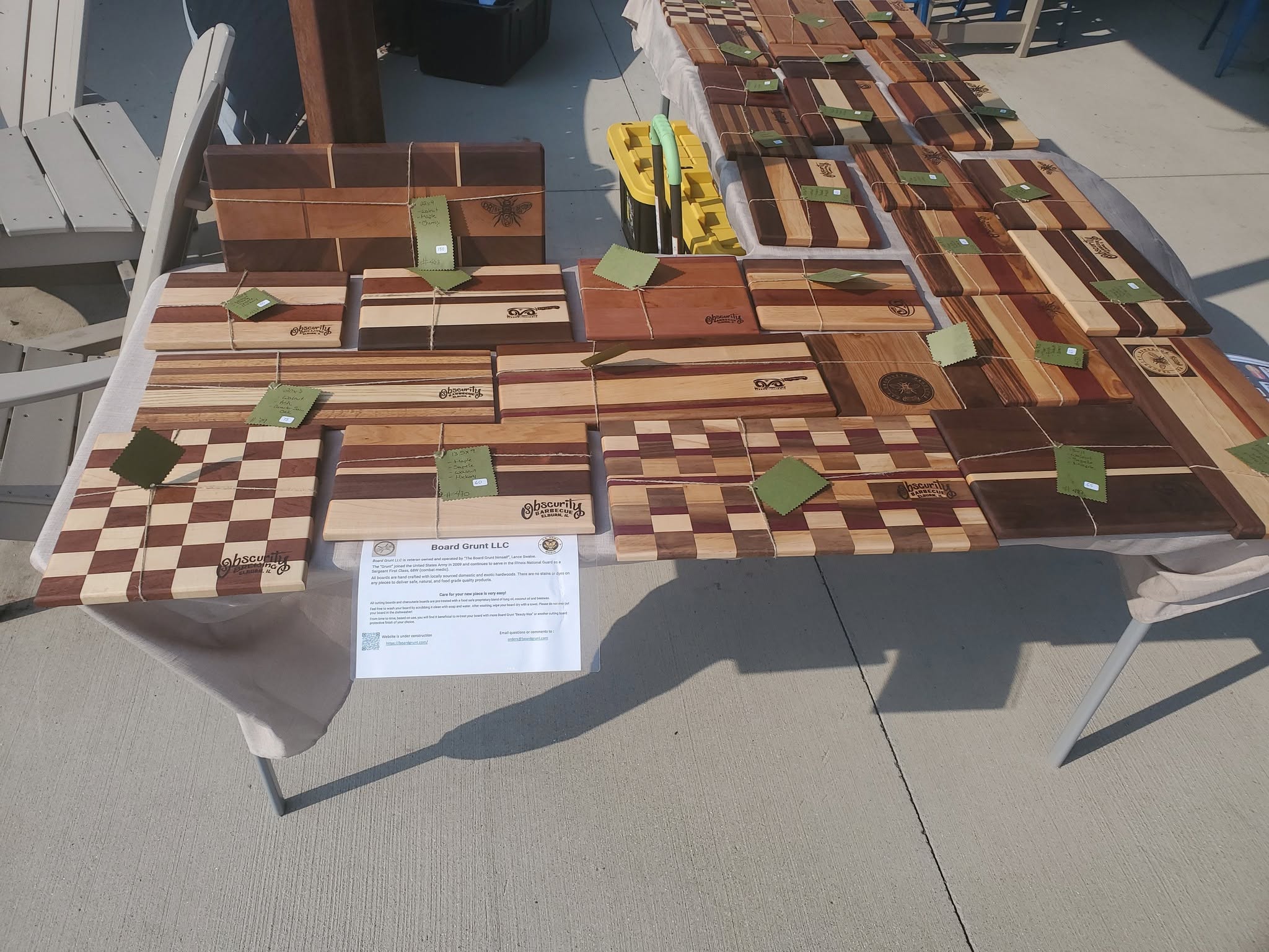 Board Grunt handmade cutting boards on display at a market