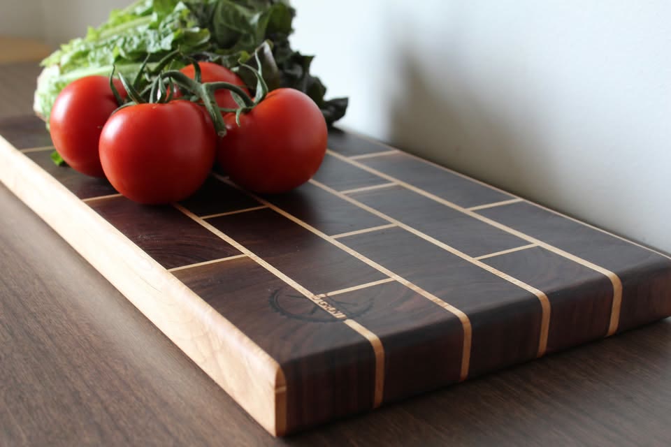 Fresh tomatoes on a walnut end-grain board by Board Grunt